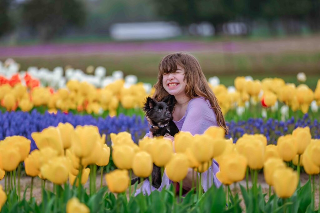 Dog-and-girl-in-tulips