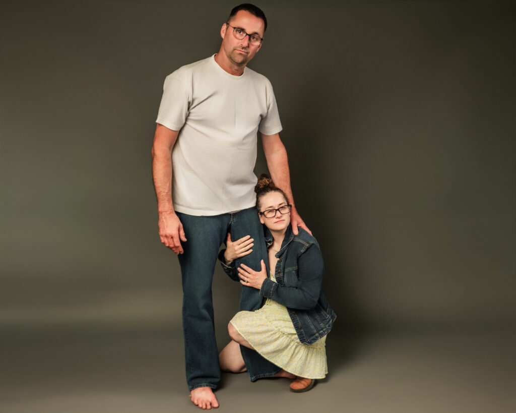 A couple poses awkwardly